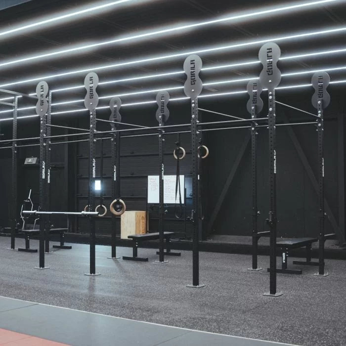 Custom bright yellow Commercial gym equipped with Gorila Fitness rigs, racks, and strength training stations — professional-grade setup for training centers in Canada.