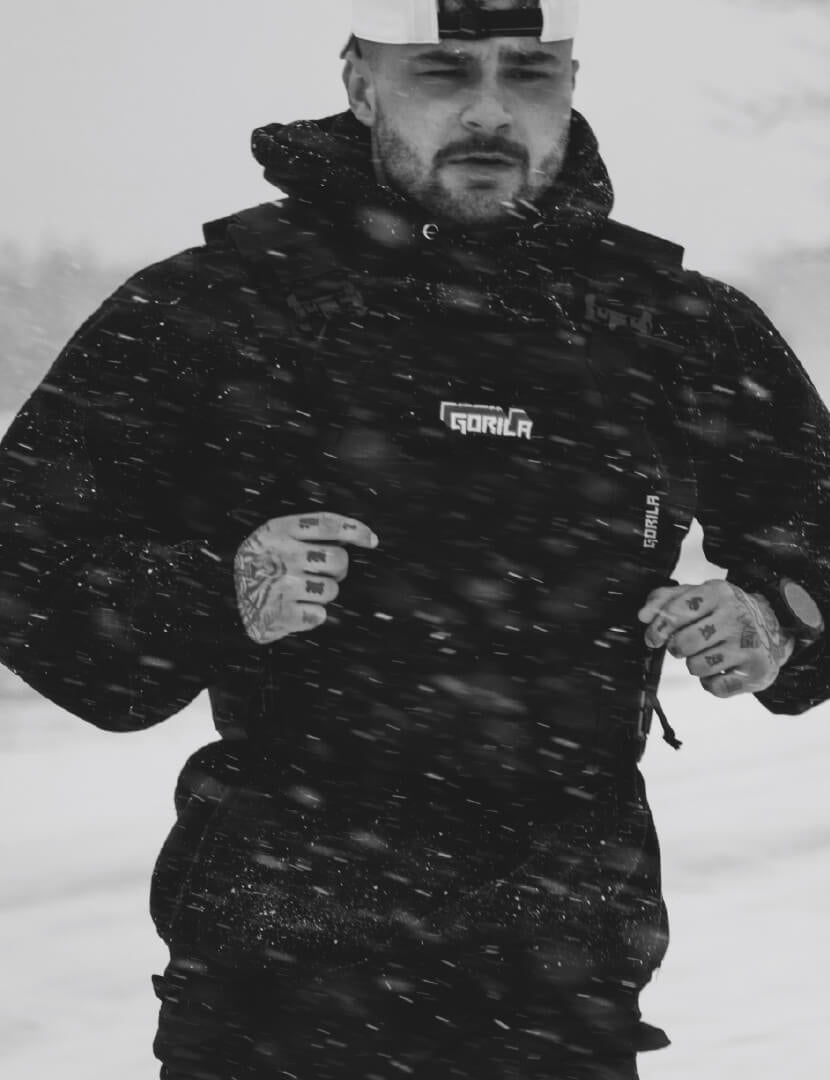 One athlete wearing black jackets with 'Gorilla' branding in a snowy landscape.