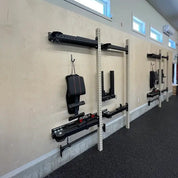 Gorila AF35 Fold Back Racks mounted and folded on a wall in a fitness center