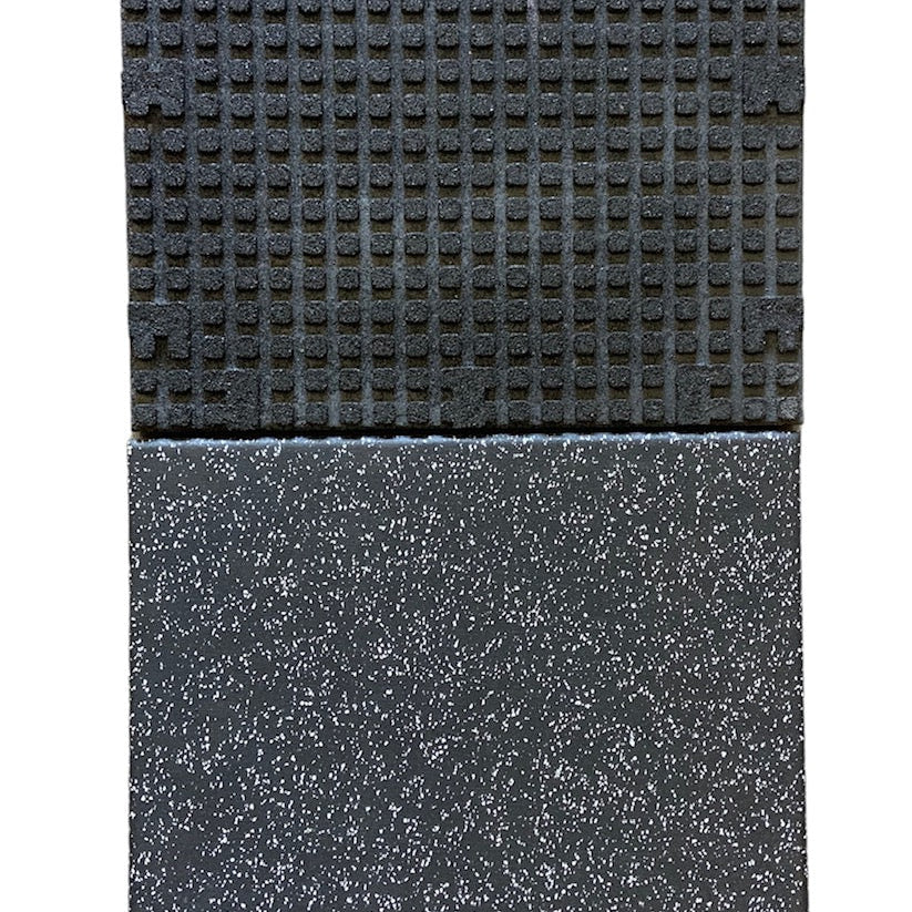 Stacked Regupol gym tiles highlighting the embossed bottom design and smooth top layer, engineered for heavy weightlifting and shock absorption, available from Gorila Fitness Canada.