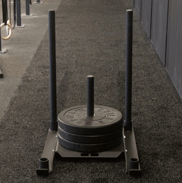 Front view of Gorila Gator Sled loaded with Gorila Ox HG bumper plates for weighted sled pushes and strength workouts.