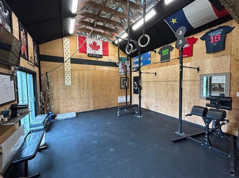 Garage gym with pull-up bar and squat rack in Canada