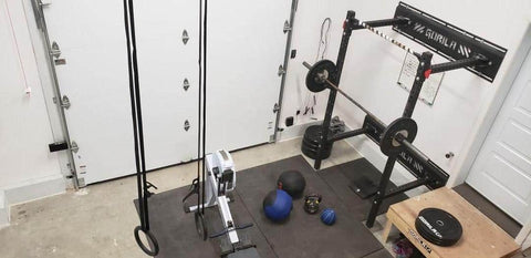 Garage gym squat rack setup in a Canadian home