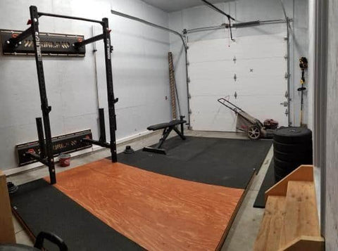 Garage gym setup with squat rack in a Canadian home
