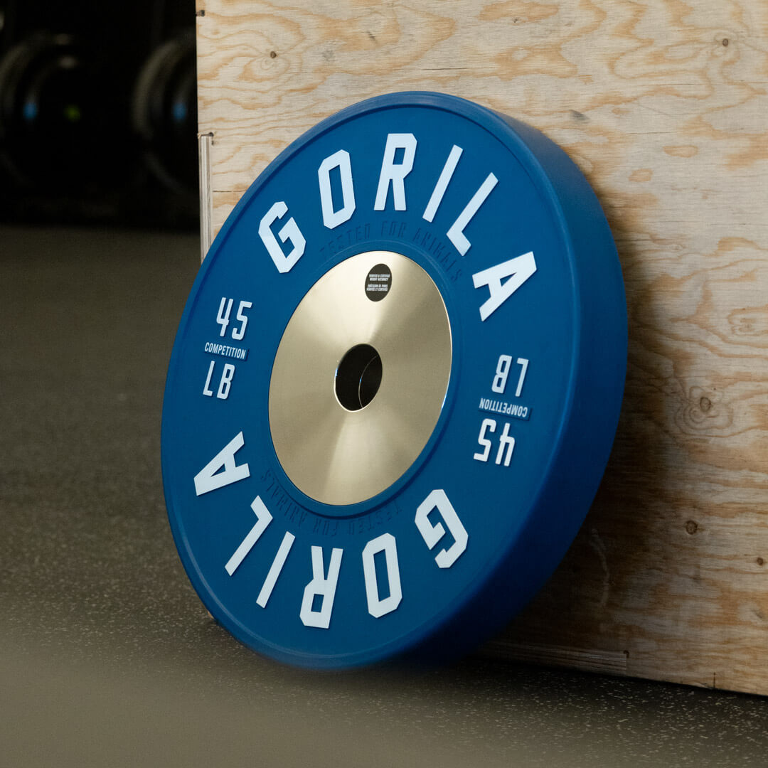 Blue 45 lb Gorila LB Competition Plate resting on a gym floor