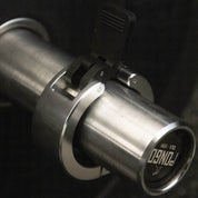 Gorila Aluminium Collars locked on an Olympic barbell loaded with bumper plates, illustrating the tight fit, durability, and modern design of Gorila lifting equipment.