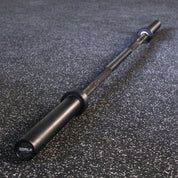 Full view of the Gorila Bar Teflon on gym flooring – durable 20KG barbell with 28MM shaft, dual knurl marks, and matte black PTFE coating.
