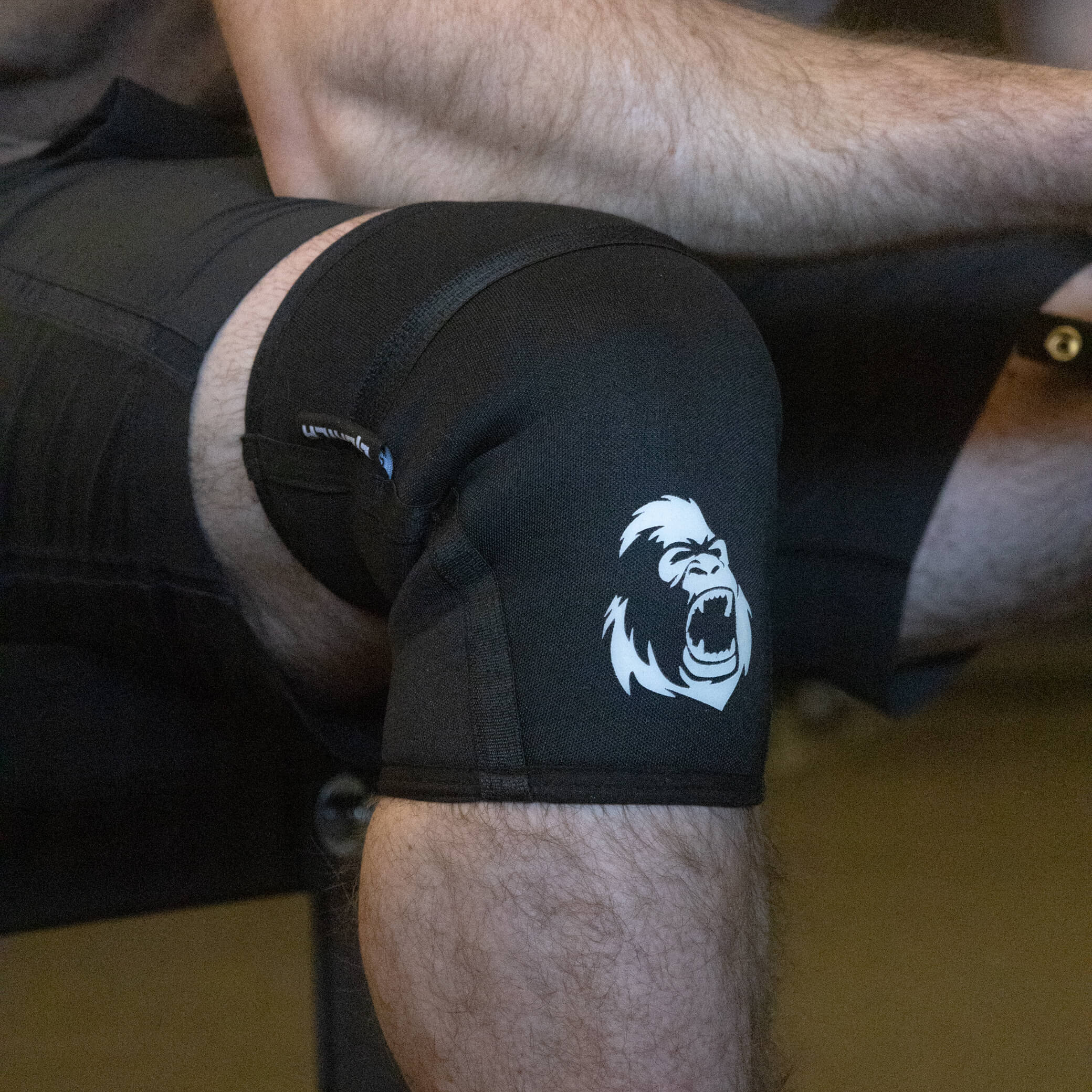 Athlete wearing Gorila Black Knee Sleeves 3.0 5 mm in before a squat demonstrating fit and knee support.