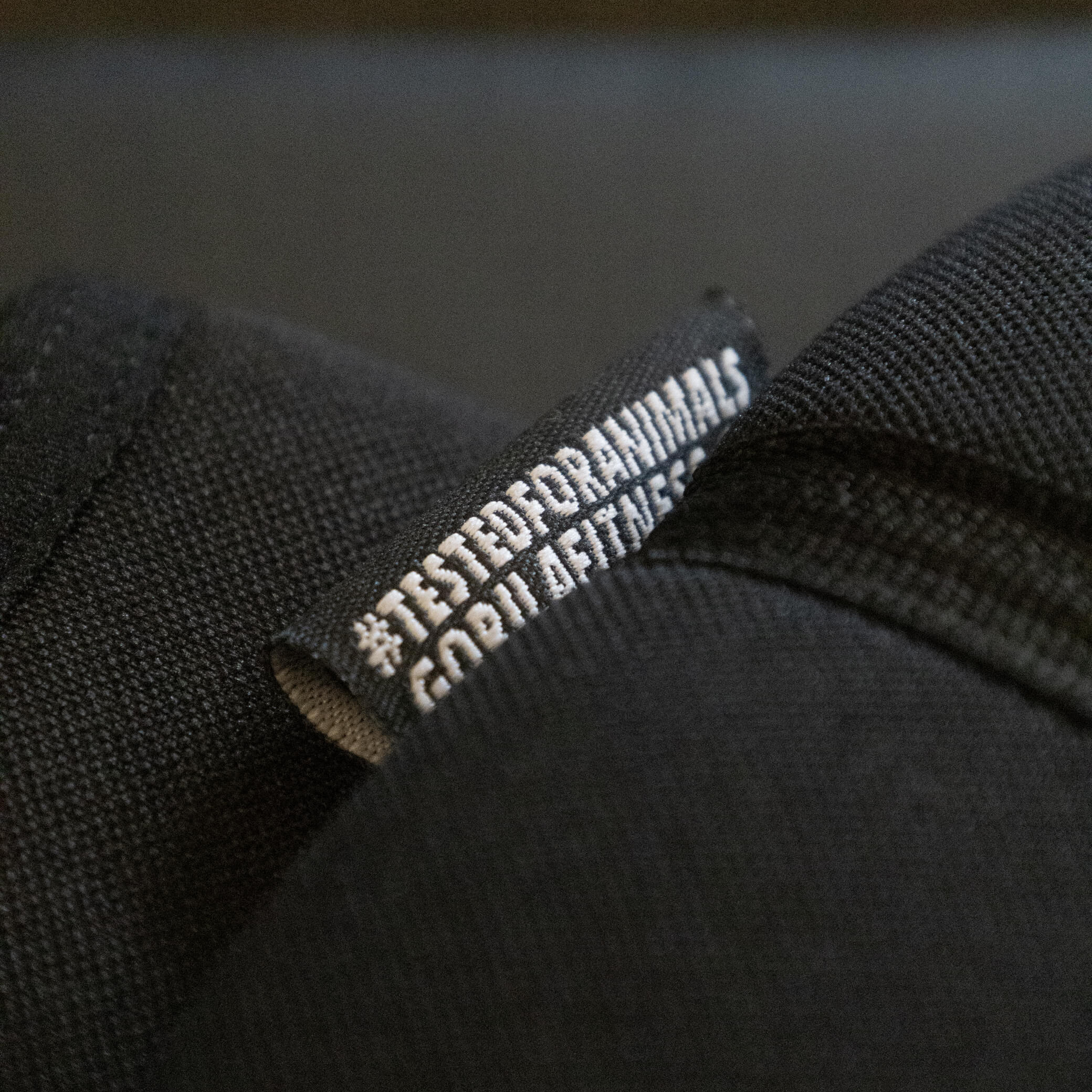 Detailed view of reinforced stitching and upper edge on Gorila Black Knee Sleeves 3.0 for durability.