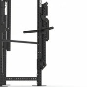 Detail view of Gorila Bull Belt Squat Attachment folded on power rack with plate holder and angled steel construction for stable weight loading.