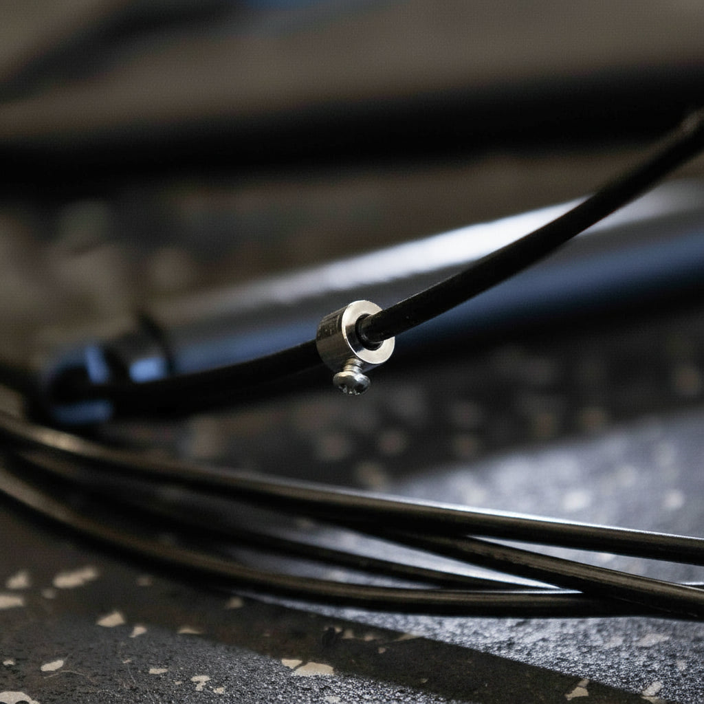 Close-up of the Gorila CSR2 Speed Rope screw and cable attachment system, showing precision threading and secure fit for adjustable, high-speed skipping performance.