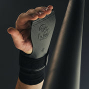 Action shot of an athlete using Gorila Death Grips during a pull-up bar workout, showing real use of premium hand protection grips for CrossFit Butterfly pull-ups