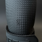 Close-up of Gorila Death Grips showing durable rubber-like texture designed for maximum grip and gymnastic hand protection during intense training.