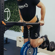 Athlete performing weighted dips using Gorila Leather Dip Accessory Strap and chain setup for strength and hypertrophy training.