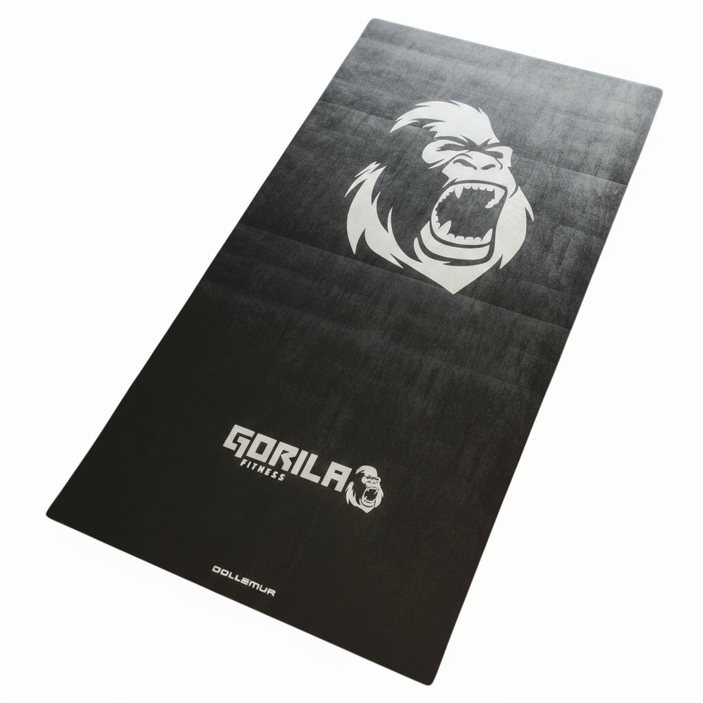 Gorila Fitness Dollamur training mat in matte black finish featuring large roaring gorilla logo and Gorila Fitness branding, designed for functional training, stretching, and gym flooring.