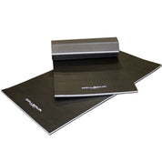 Folded Gorila Fitness Dollamur mats stacked on a white background, showing portable multi-panel design for easy storage and transport.