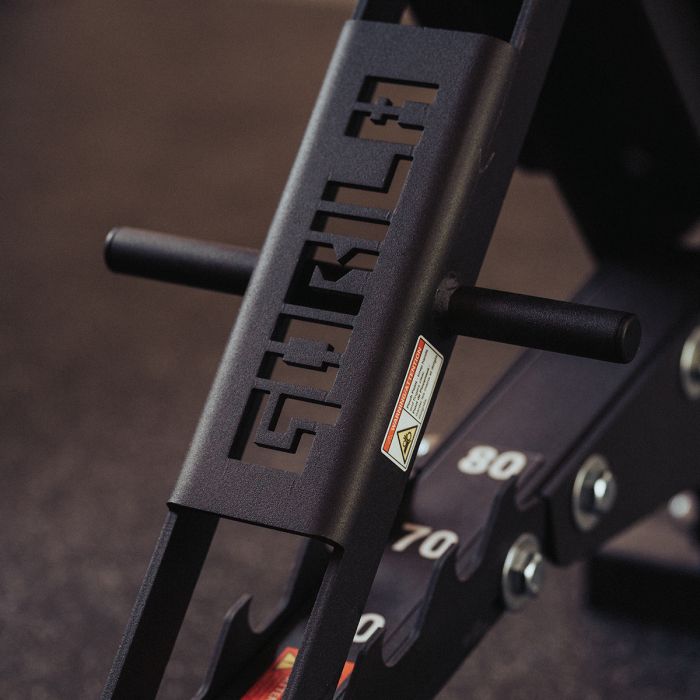 Close-up of Gorila Fitness logo cutout on adjustable bench frame, black powder-coated steel with numbered incline levels made in Canada
