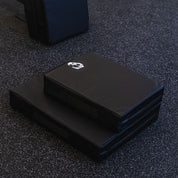 Gorila Fitness drop pads stacked in compact and regular versions, made in Canada with dense multi-layer padding for noise and impact reduction