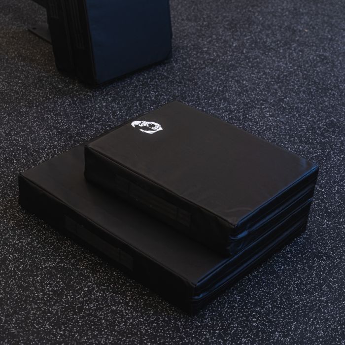 Gorila Fitness drop pads stacked in compact and regular versions, made in Canada with dense multi-layer padding for noise and impact reduction