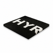 Black custom HYROX turf for gyms by Gorila Fitness, showing standard HYROX lane width and crisp white logo marking. Premium athletic turf designed for hybrid training and gym owners across Quebec, Ontario, and New Brunswick. Available in custom colors, lane configurations, and personalized branding.