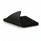 Close-up of HYROX turf corner lifted to reveal durable black foam underlayer. Premium Gorila Fitness turf engineered for shock absorption, stability, and performance. Custom-made gym flooring available in standard HYROX specifications and custom options across Ontario, Quebec, and New Brunswick.