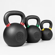 Three black kettlebells in graduated sizes with red, green, and yellow handle accents, arranged from largest to smallest on a light gray background.