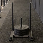 Front view of Gorila Gator Sled loaded with Gorila Ox HG bumper plates for weighted sled pushes and strength workouts.