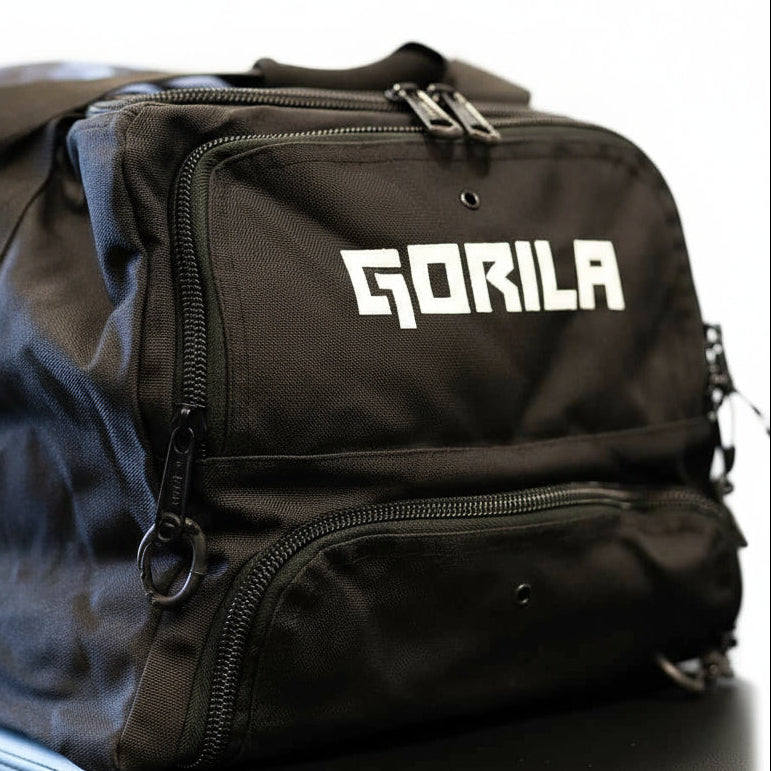 Angled view of the Gorila Gym Bag in black showing structured design and multiple compartments showing Gorila logo in white