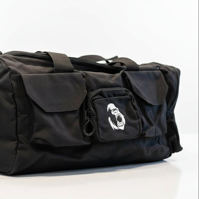 Side profile of the Gorila Gym Bag in black featuring large main pocket and bold logo