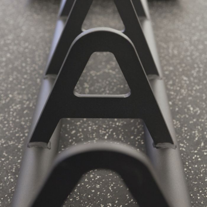 Close-up of Gorila HPS Storage separators – heavy-duty steel dividers designed to keep Olympic plates neatly organized on the portable matte black rack, showing precision welds and durable powder-coated finish