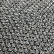 Honeycomb surface pattern of Gorila Rubber Flooring providing superior traction, shock absorption, and durability for commercial gyms and home gyms