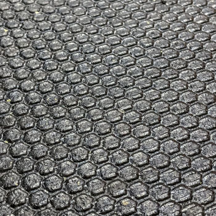 Honeycomb surface pattern of Gorila Rubber Flooring providing superior traction, shock absorption, and durability for commercial gyms and home gyms