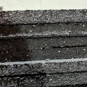 Side view showing the thickness and density of Gorila Rubber Flooring Mats, engineered for heavy equipment areas and maximum floor protection, recycled possible imperfections