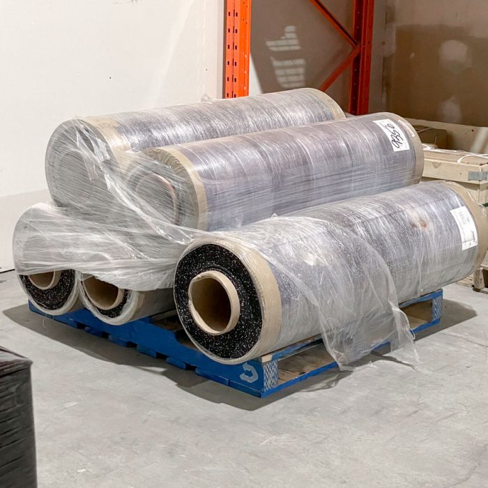 Packaged Gorila Rubber Flooring Rolls stacked on pallet ready for shipping, durable recycled rubber gym flooring for large fitness centers and strength rooms