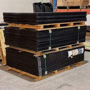 Stacked Gorila Rubber Flooring Mats made in Canada, durable and eco-friendly rubber tiles built for strength training facilities and CrossFit gyms