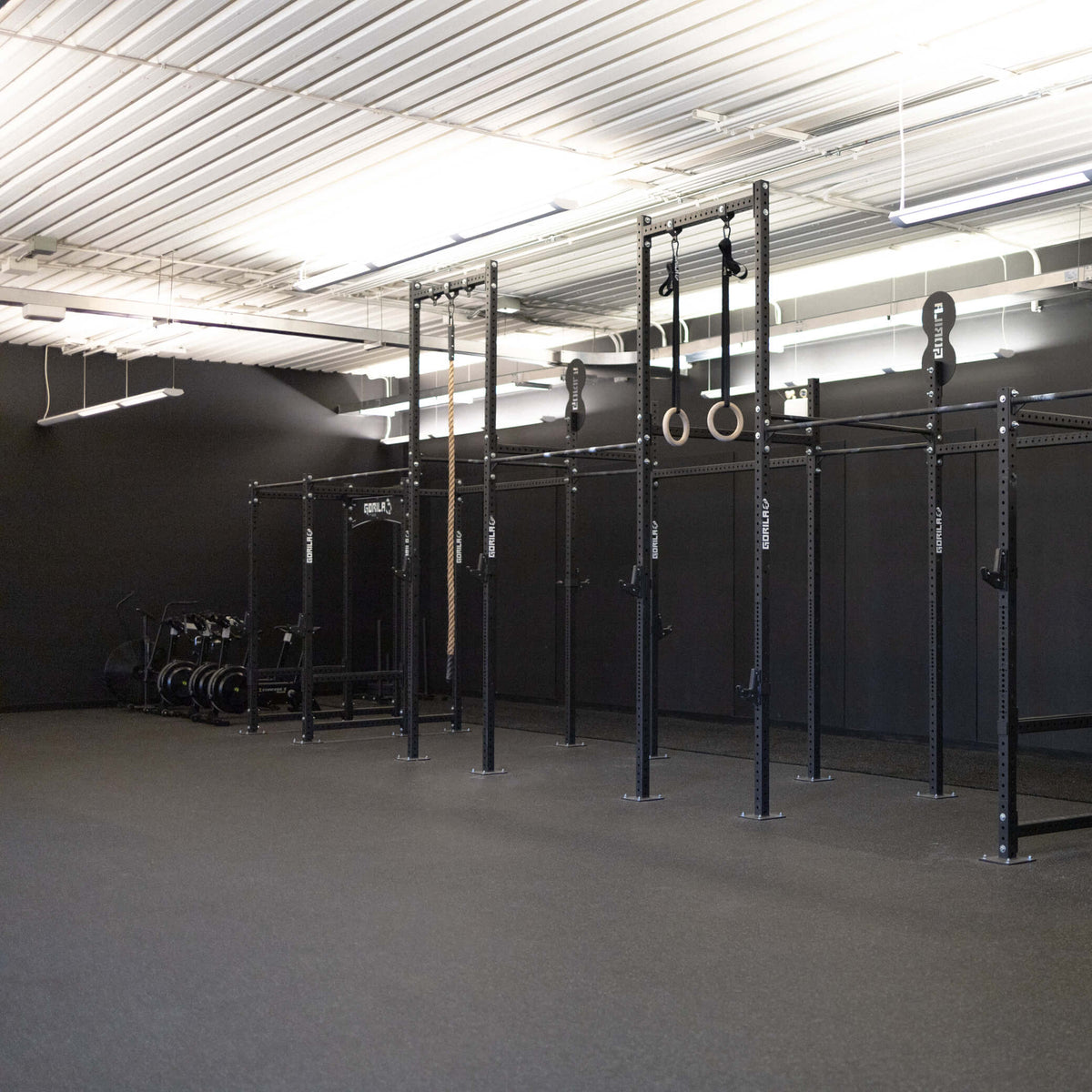 Rubber rolls installed wall to wall in a Crossfit Era Gym