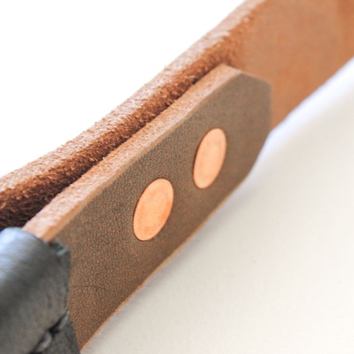 Detailed view of Gorila leather tricep strap rivets and craftsmanship, highlighting precision stitching and copper hardware.