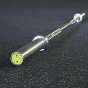 Gorila Women Training Bar 2.0 endcap with yellow logo – precision-engineered barbell with four large needle bearings, brass bushings, and 180,000 PSI tensile steel
