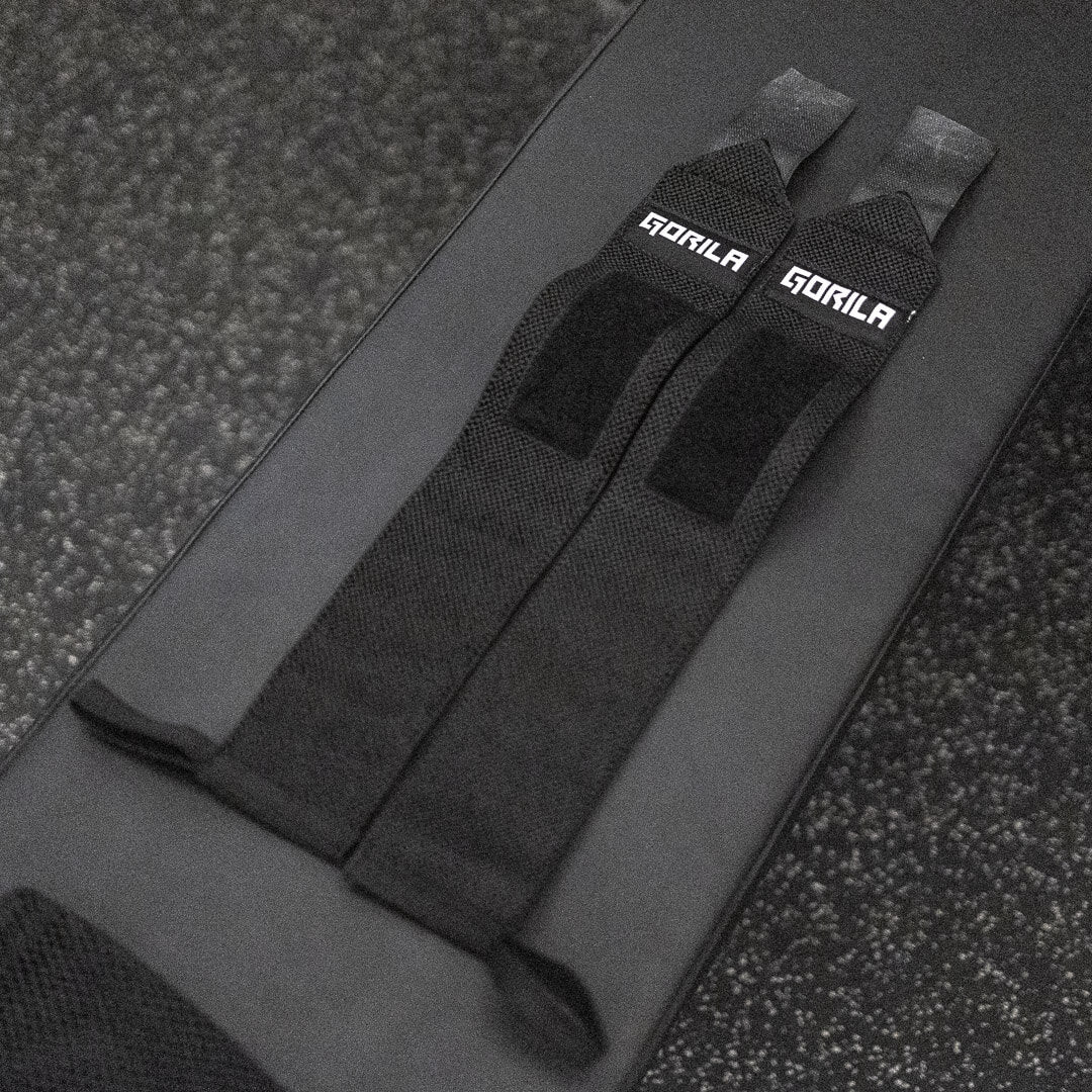 Pair of Gorila Wrist Wraps stacked together on crossfit gym surface.