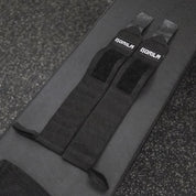 Pair of Gorila Wrist Wraps stacked together on crossfit gym surface.