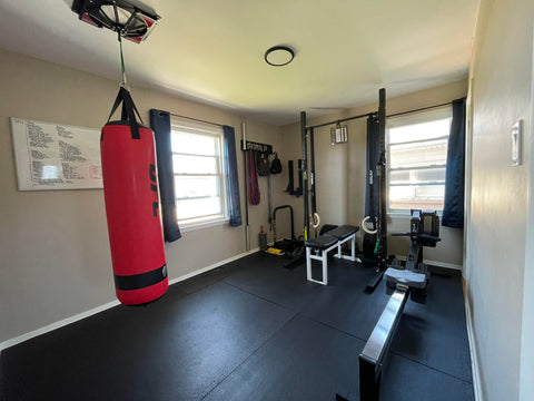 Finished home gym setup with power rack in a Canadian garage