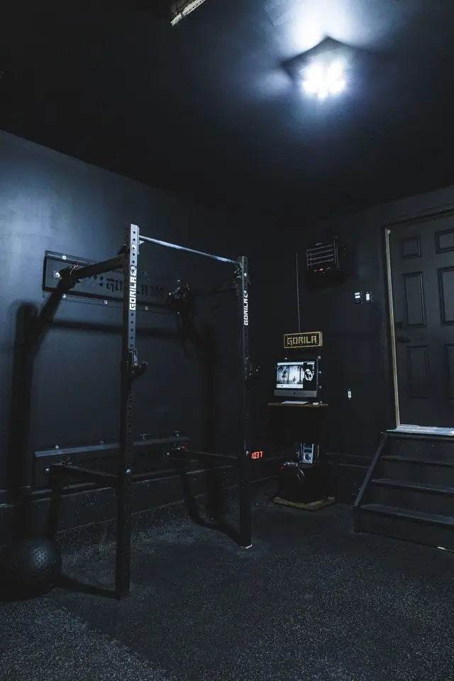 Black-on-black Gorila squat rack setup in a high-end home gym, perfect for custom rack selection.