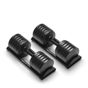 Angle view of Nuobell 100 lb adjustable dumbbells on compact stand, modern home gym setup