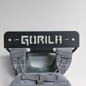 Picture of a Weight Vest hanging from the Universal Gorila Fitness Plate Carrier Wallmount Storage.